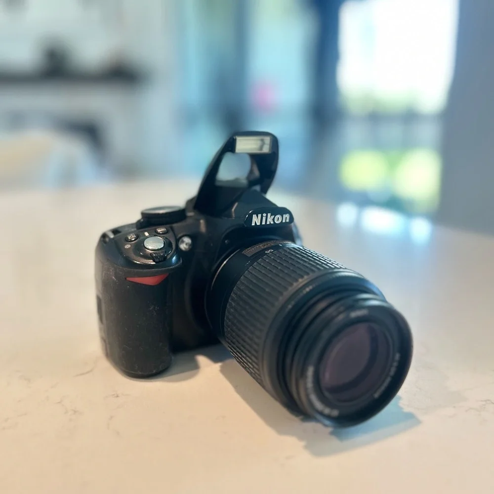 Nikon D3100 DSLR Camera with 55-200mm lens